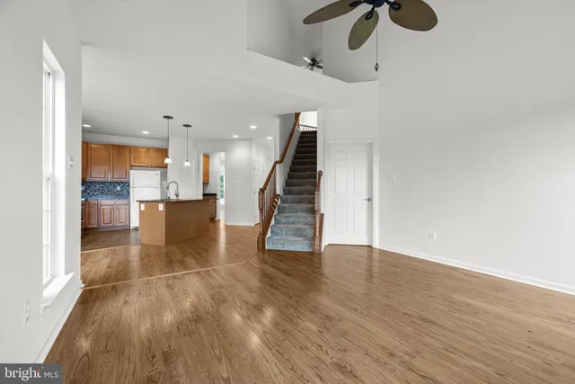 a view of an entryway with wooden floor