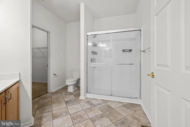 a bathroom with a shower and a toilet