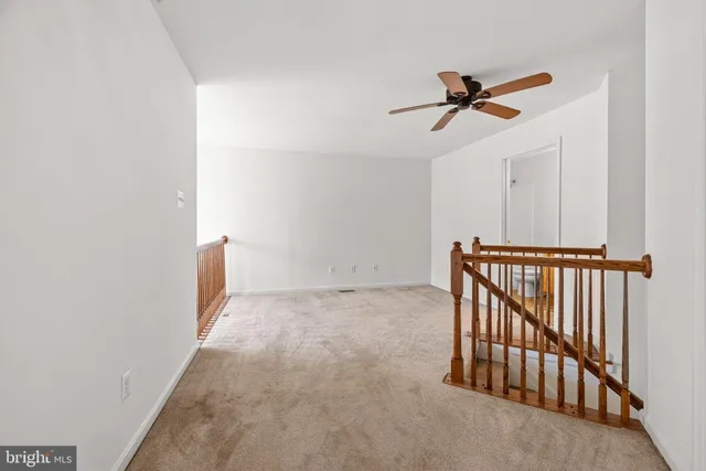 a view of a hallway with a room