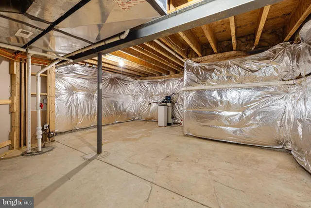 a front view of a house with a yard table and chairs