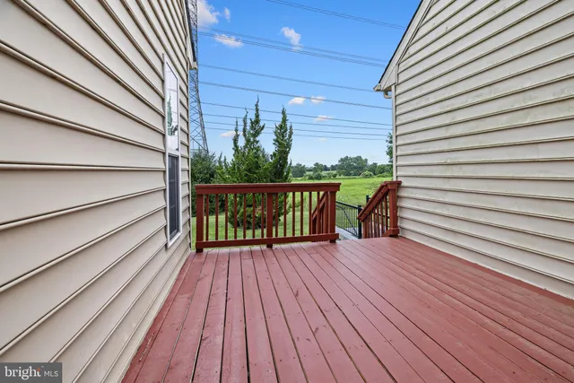 a aerial view of a house next to a yard with plants and trees
