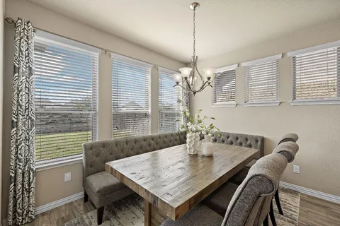 a view of a dining room with furniture window and outside view