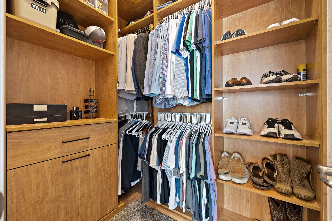 504 Leon Loop Liberty Hill, TX 78642 - Photo 22 of 40 a view of walk in closet with clothes and shoes