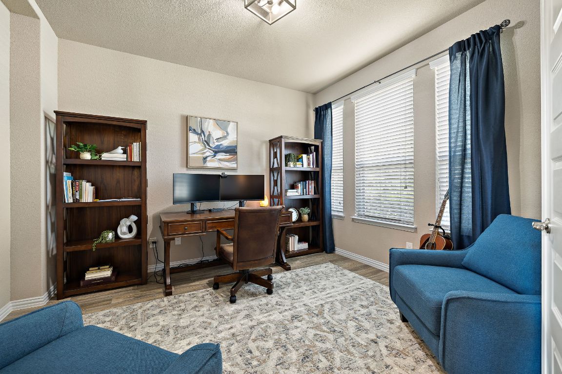 504 Leon Loop Liberty Hill, TX 78642 - Photo 23 of 40 a living room with furniture rug and window
