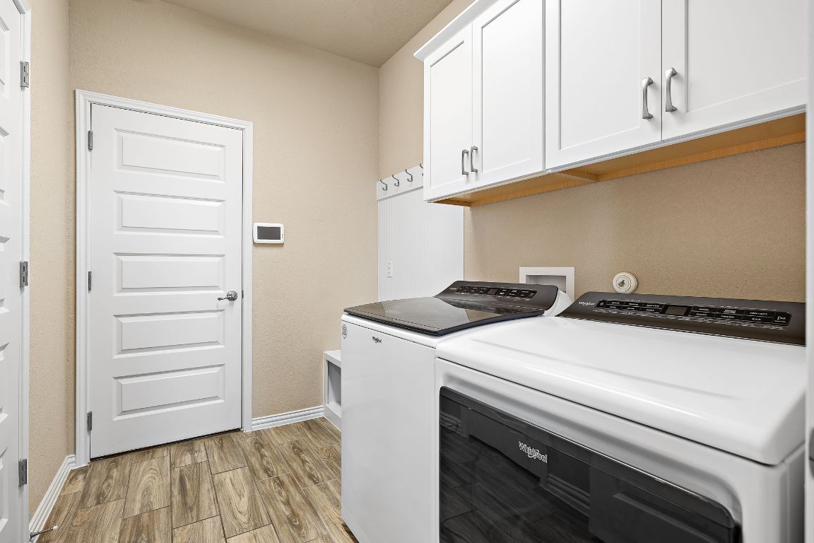 504 Leon Loop Liberty Hill, TX 78642 - Photo 33 of 40 a utility room with dryer and washer