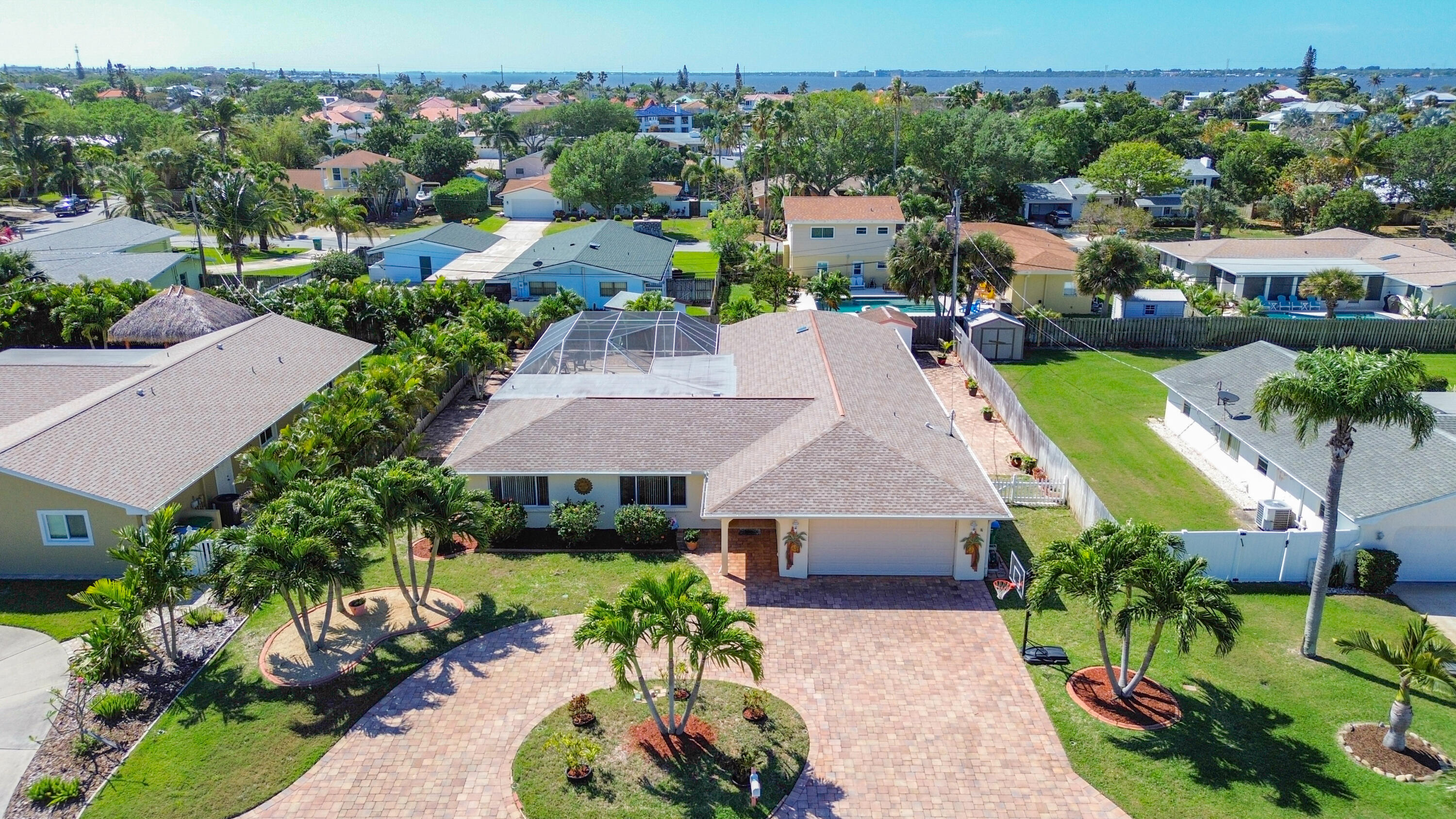 409 Surf Road Melbourne Beach, FL 32951 - Photo 1 of 34 an aerial view of a house with a garden