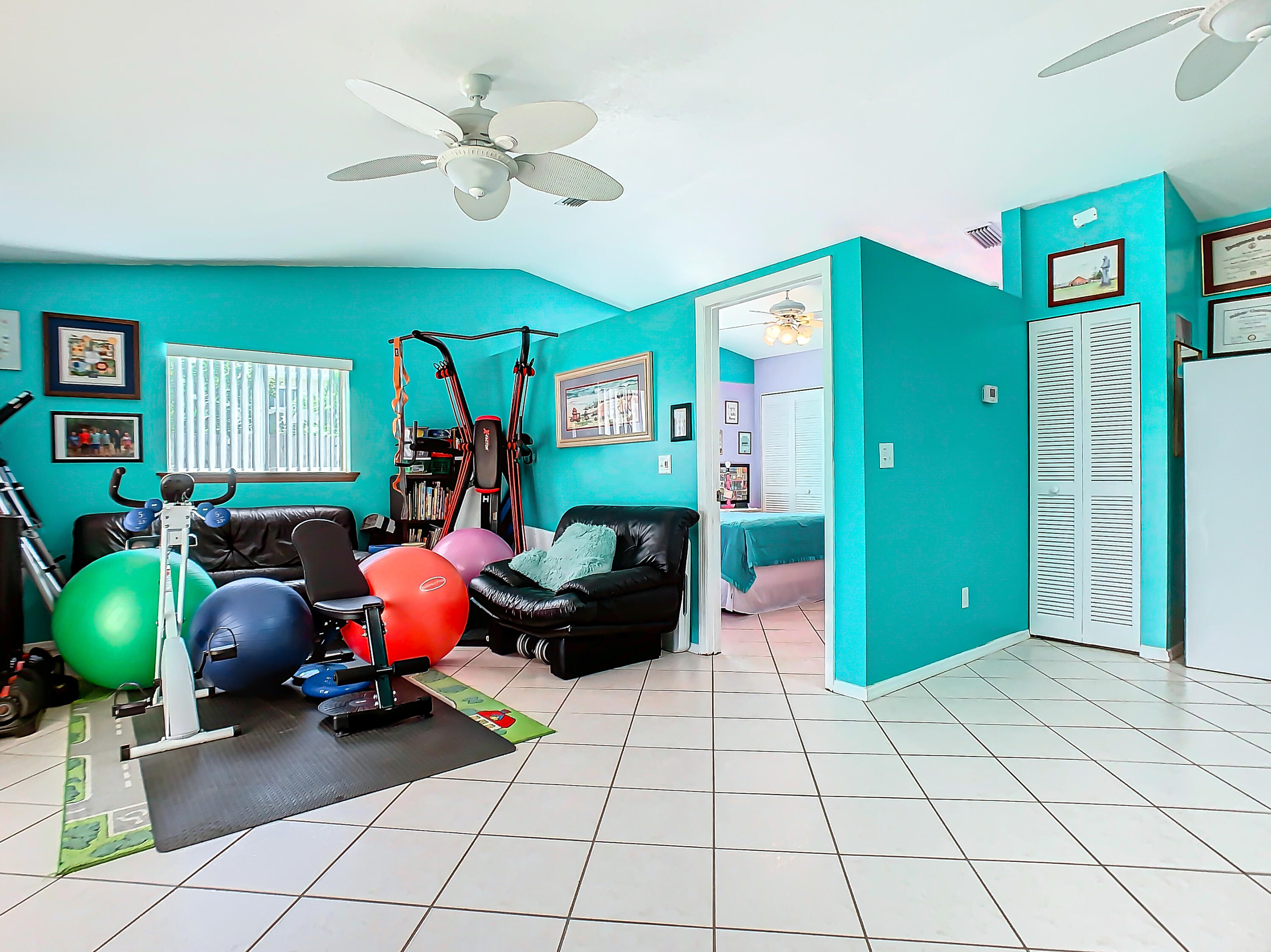 409 Surf Road Melbourne Beach, FL 32951 - Photo 22 of 34 a living room with furniture and a chandelier