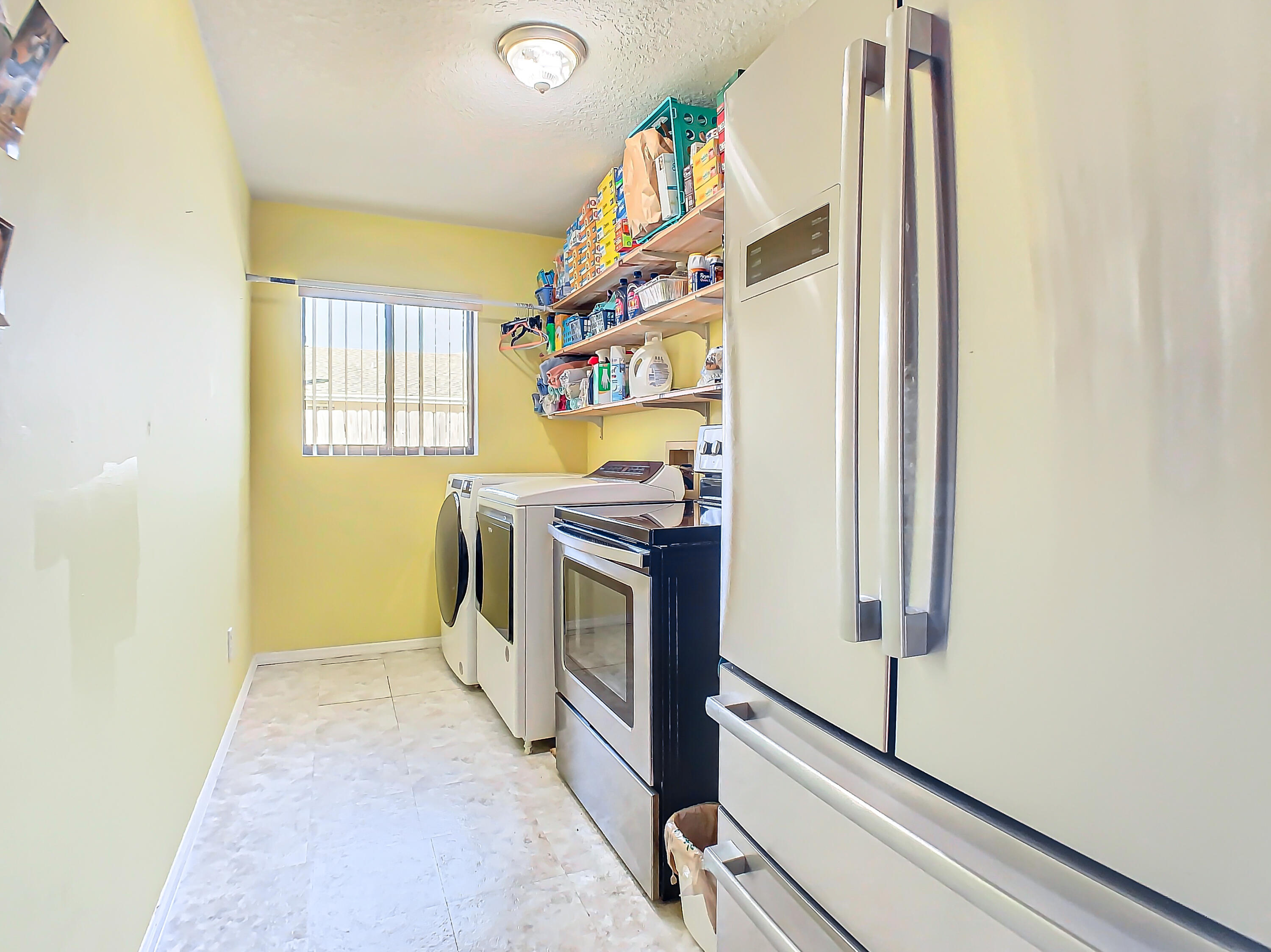 409 Surf Road Melbourne Beach, FL 32951 - Photo 25 of 34 a view of a hallway with washer and dryer