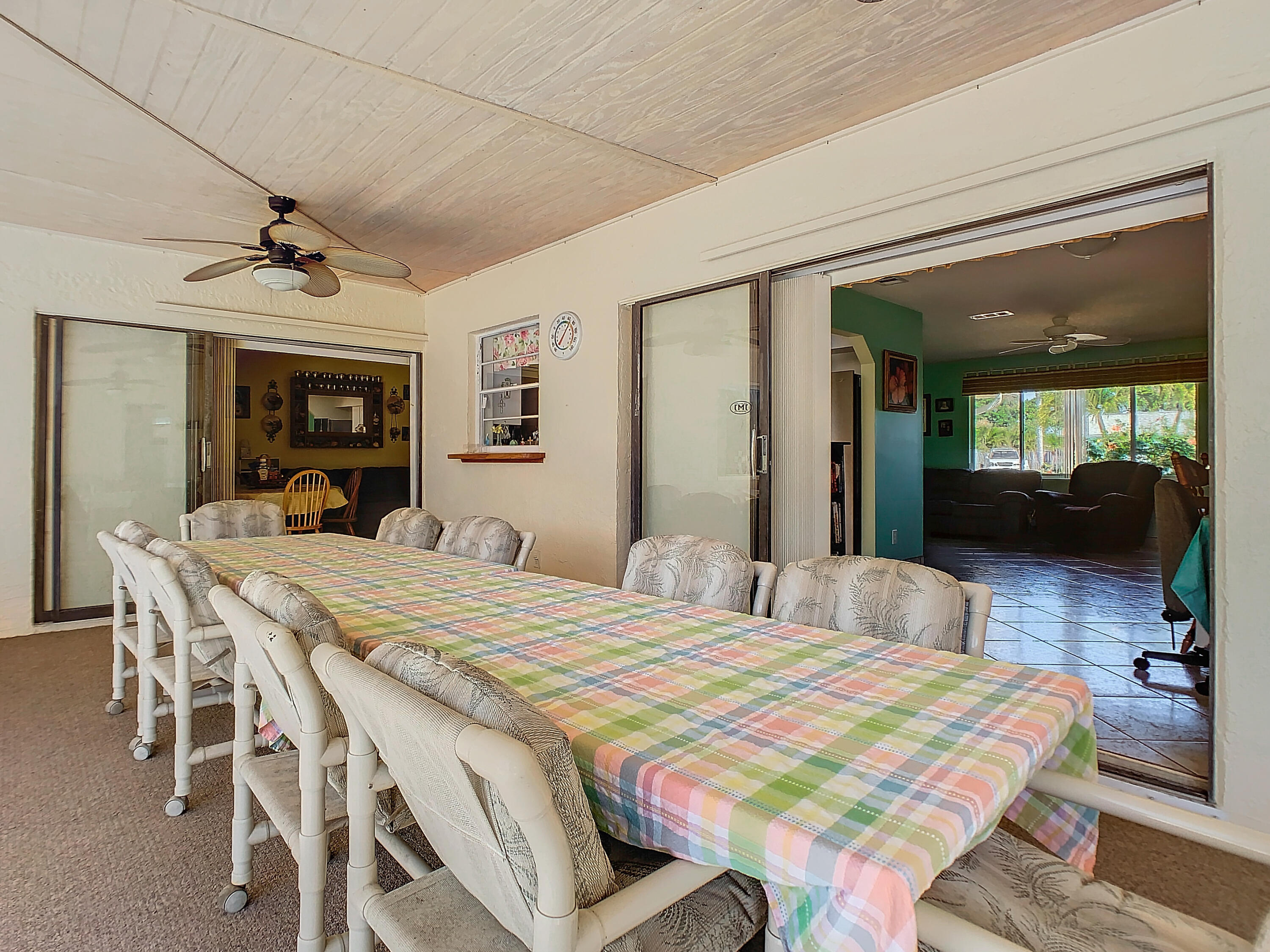 409 Surf Road Melbourne Beach, FL 32951 - Photo 28 of 34 a bedroom with a bed and a large mirror with furniture