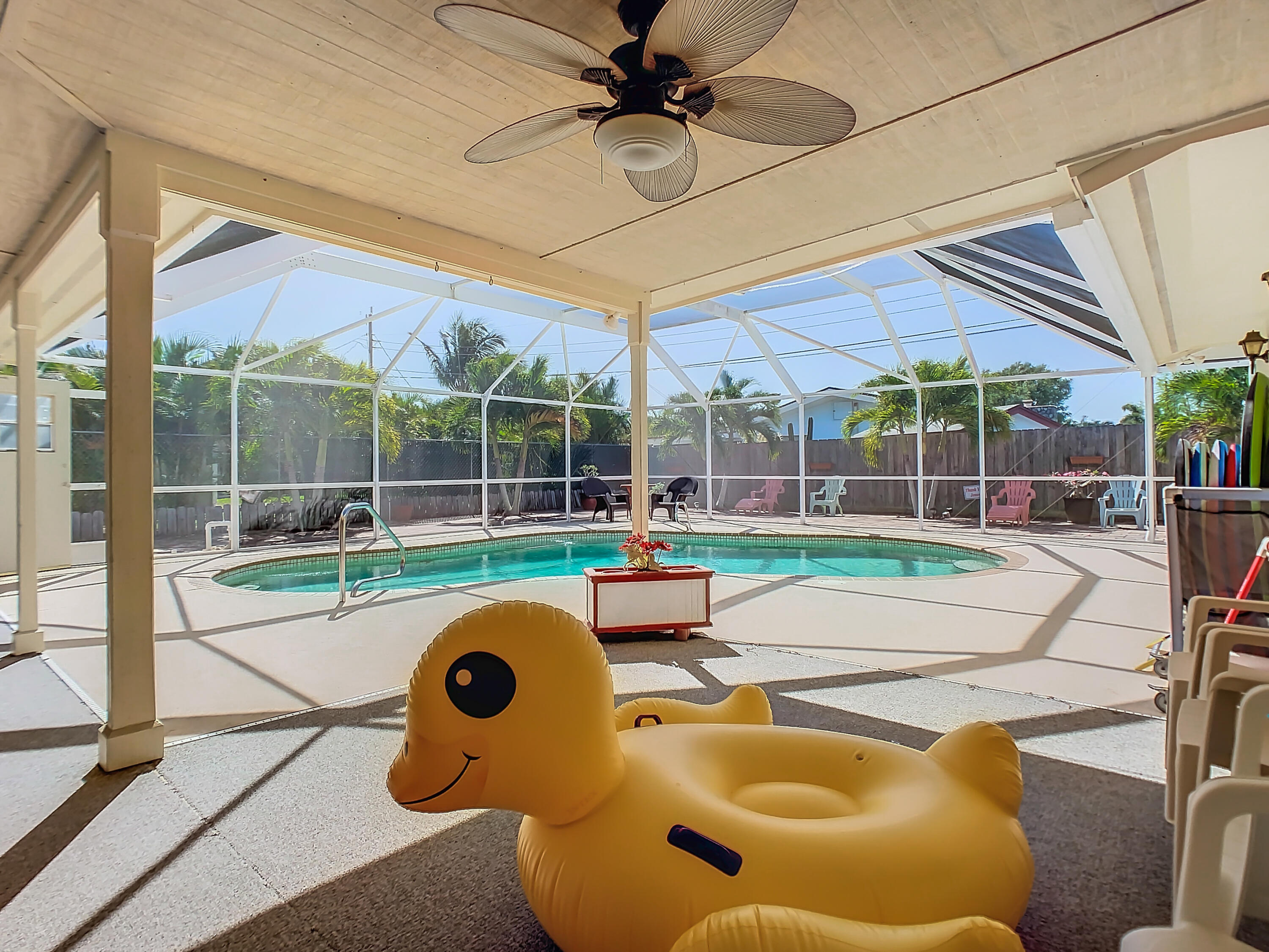 409 Surf Road Melbourne Beach, FL 32951 - Photo 29 of 34 a view of a backyard with swimming pool