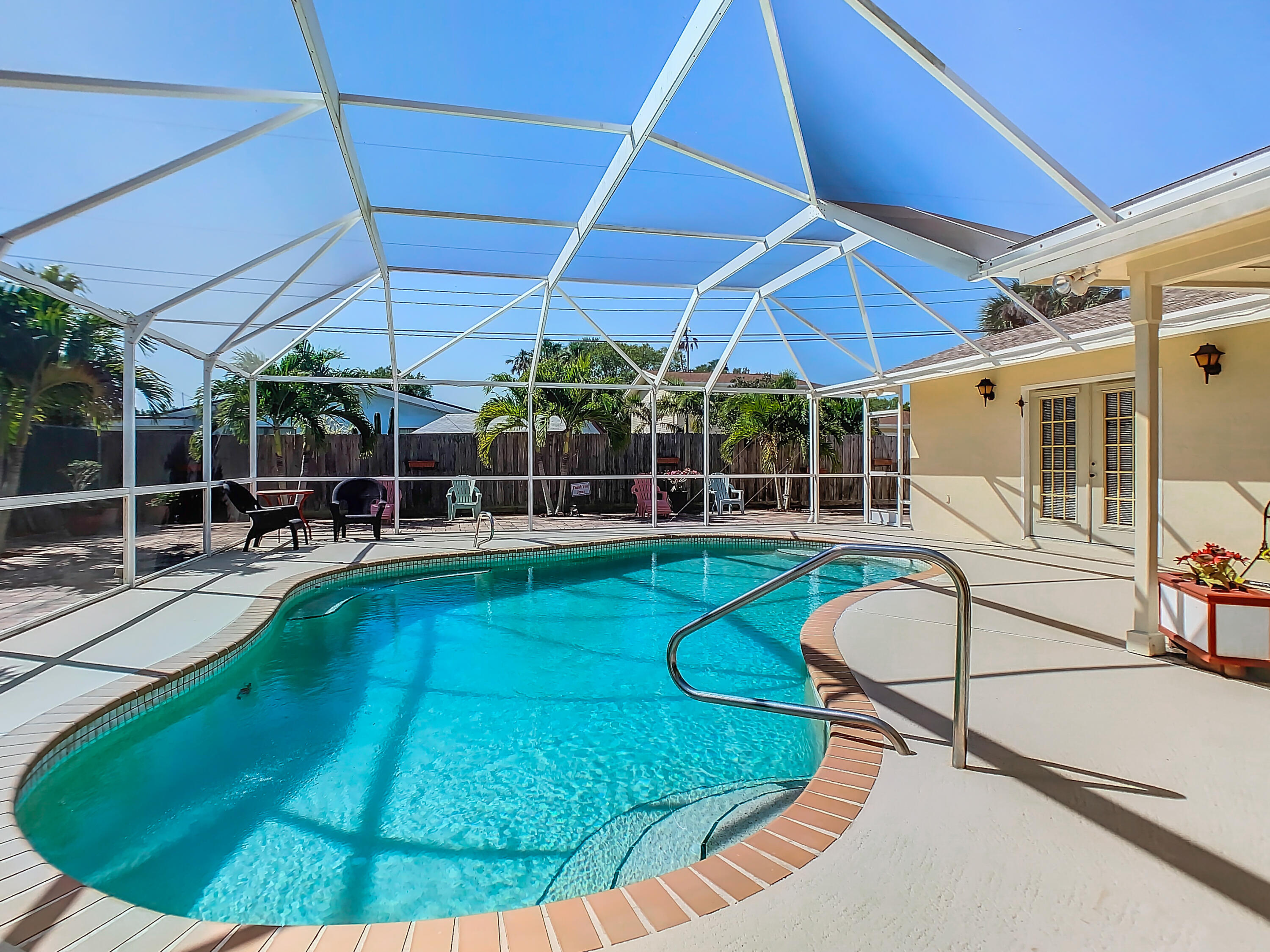 409 Surf Road Melbourne Beach, FL 32951 - Photo 30 of 34 a view of a swimming pool with a patio