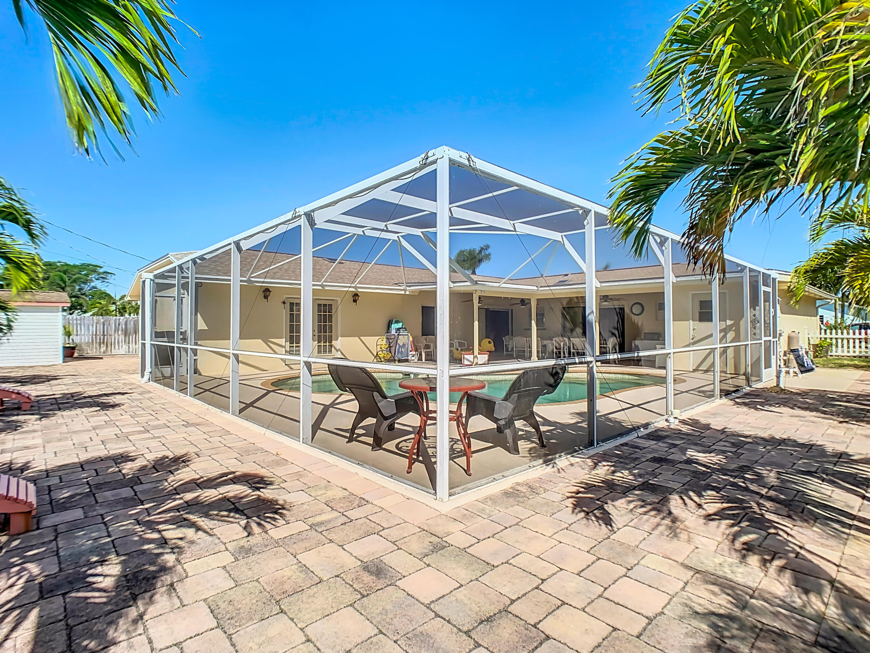 409 Surf Road Melbourne Beach, FL 32951 - Photo 31 of 34 a view of a house with backyard and sitting area