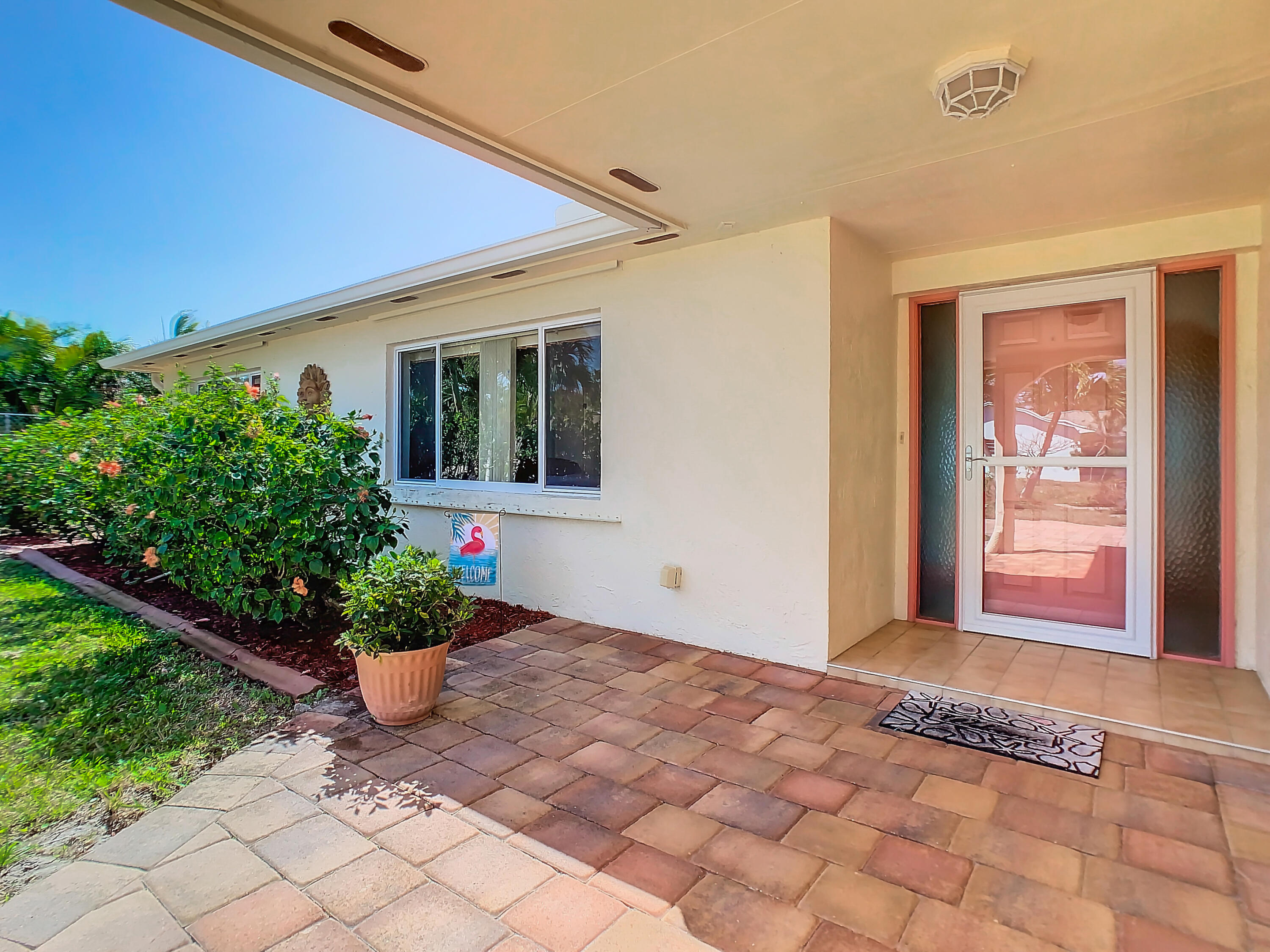 409 Surf Road Melbourne Beach, FL 32951 - Photo 4 of 34 a view of a house with a yard