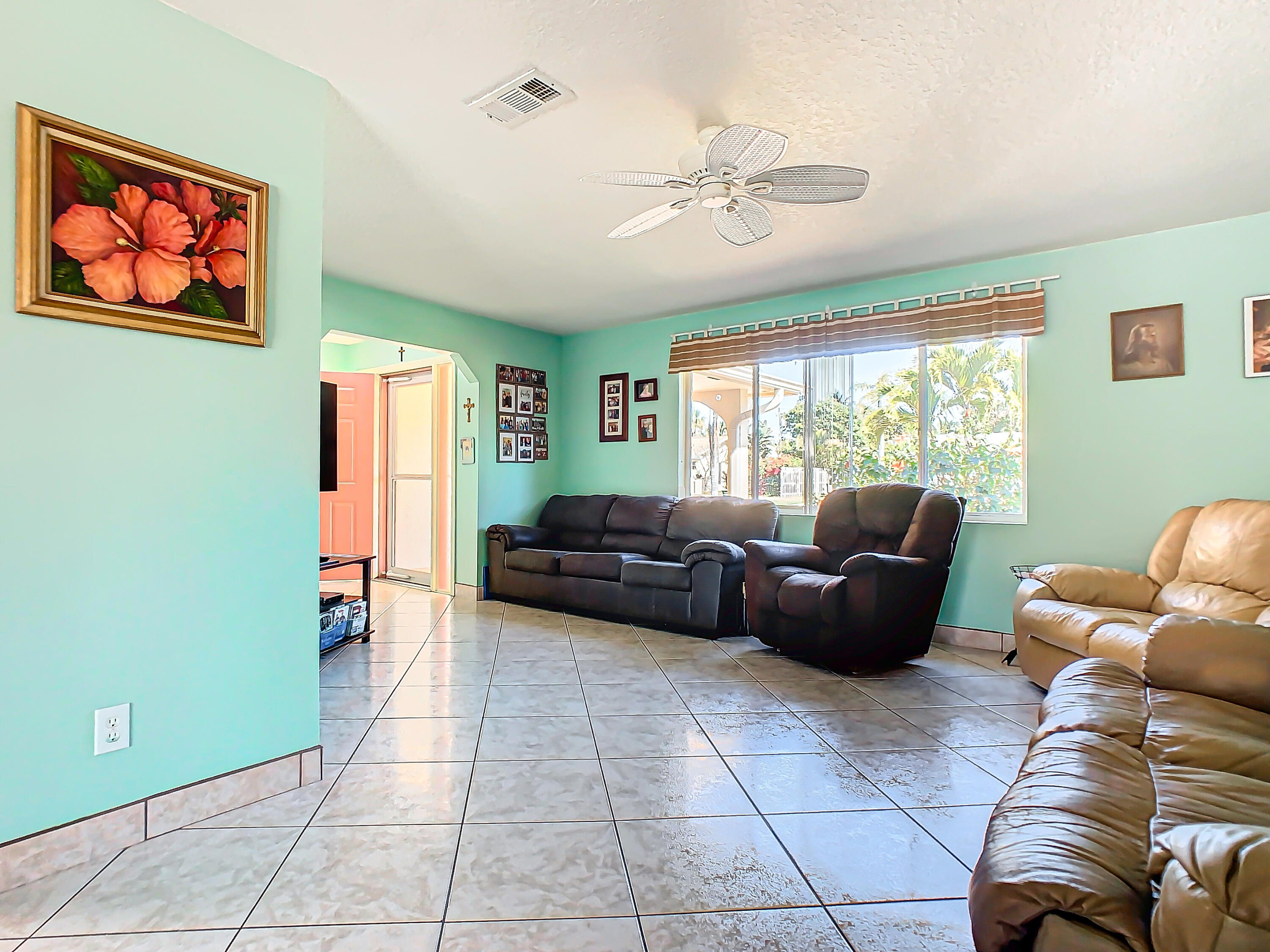 409 Surf Road Melbourne Beach, FL 32951 - Photo 6 of 34 a living room with furniture and a window