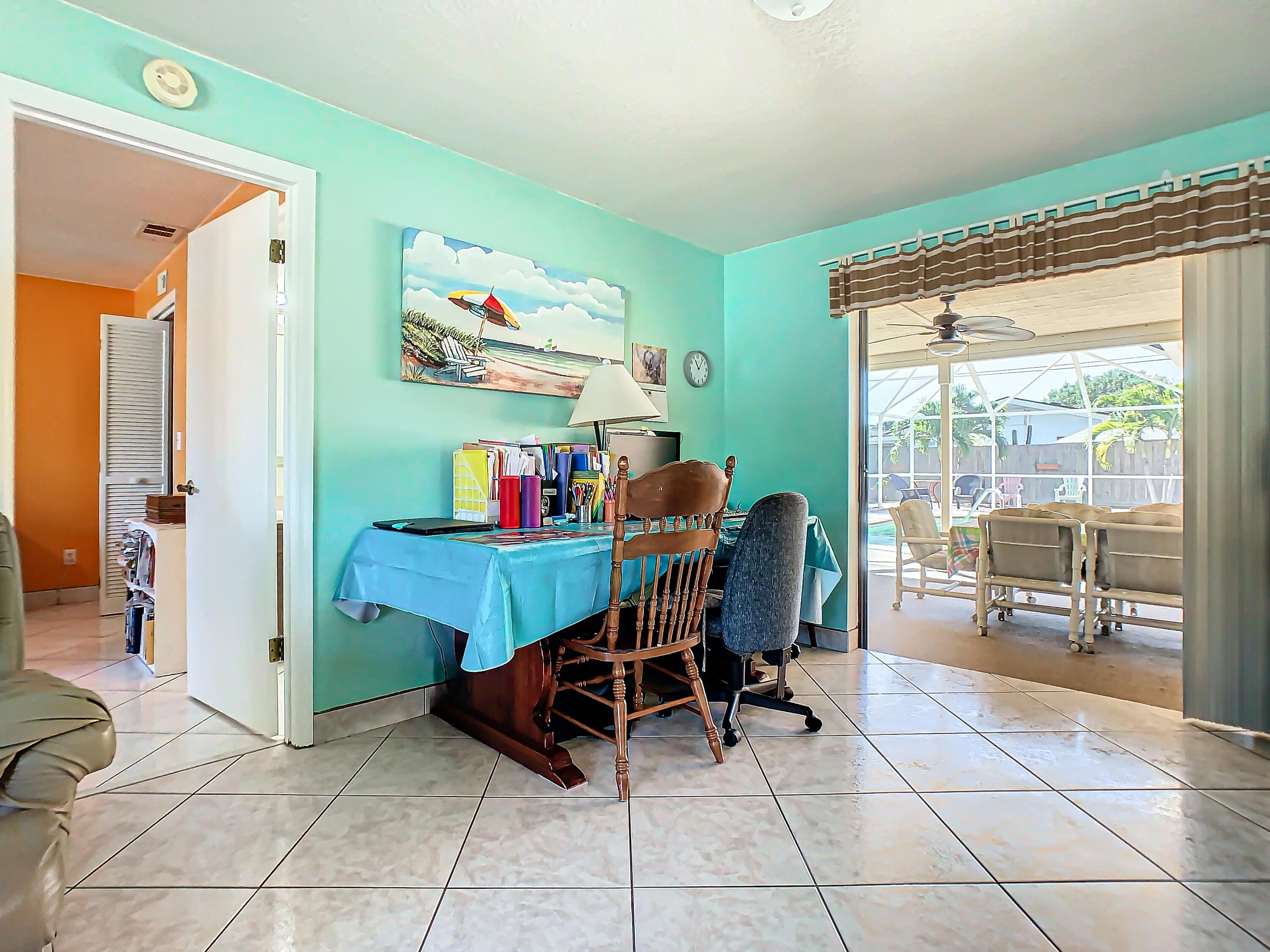 409 Surf Road Melbourne Beach, FL 32951 - Photo 7 of 34 a dining room with furniture and a floor to ceiling window