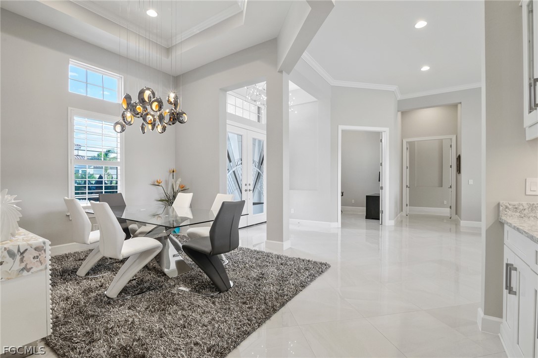 9345 Tulipano Terrace Naples, FL 34119 - Photo 14 of 50 a living room with furniture and a rug