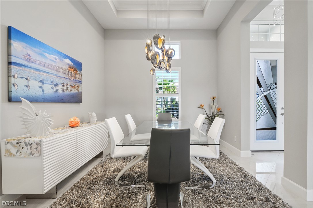 9345 Tulipano Terrace Naples, FL 34119 - Photo 15 of 50 a living room with furniture and a painting on the wall