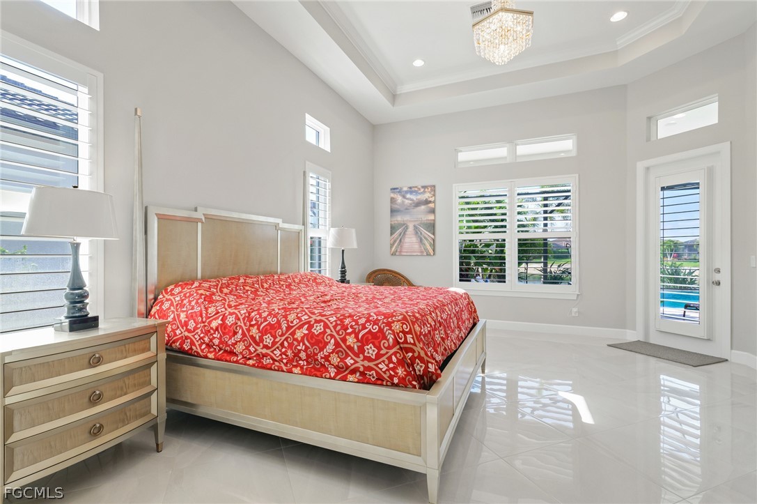 9345 Tulipano Terrace Naples, FL 34119 - Photo 17 of 50 a bed room with a bed and a window