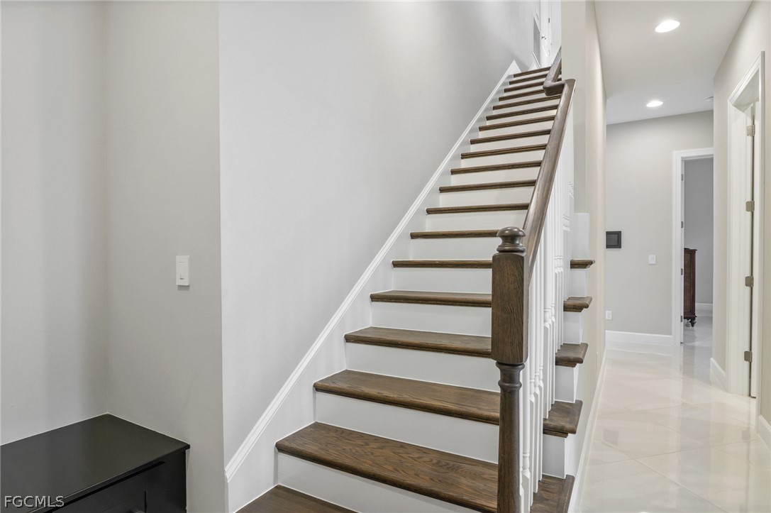 9345 Tulipano Terrace Naples, FL 34119 - Photo 29 of 50 a view of entryway with wooden floor
