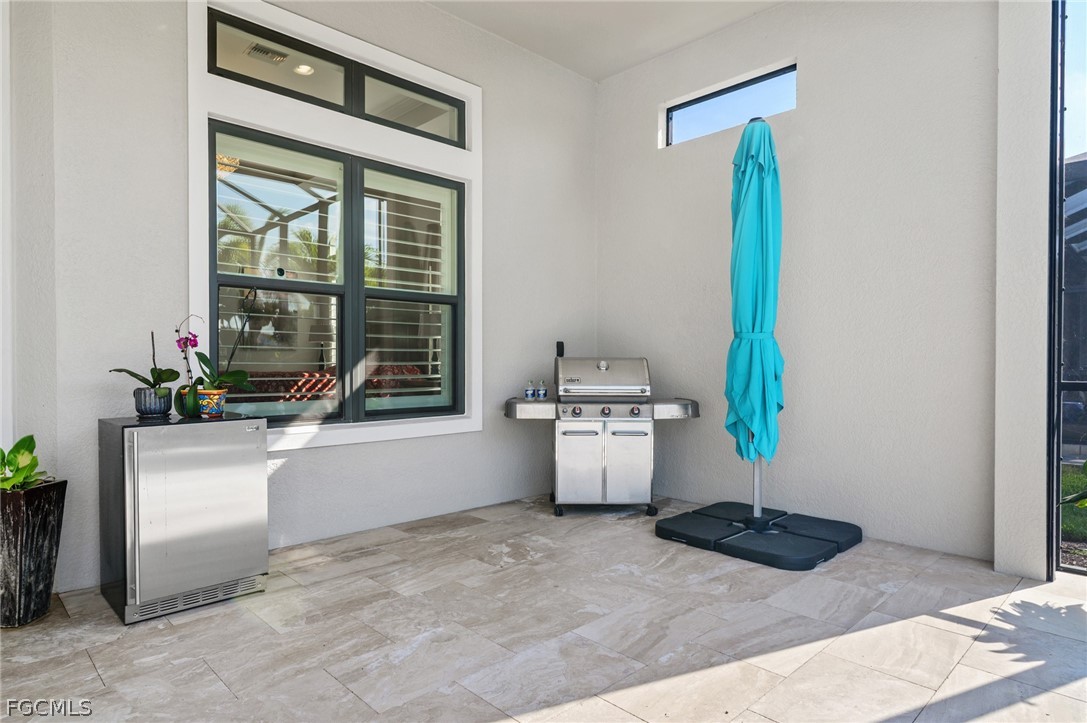 9345 Tulipano Terrace Naples, FL 34119 - Photo 41 of 50 a room with a washer and dryer