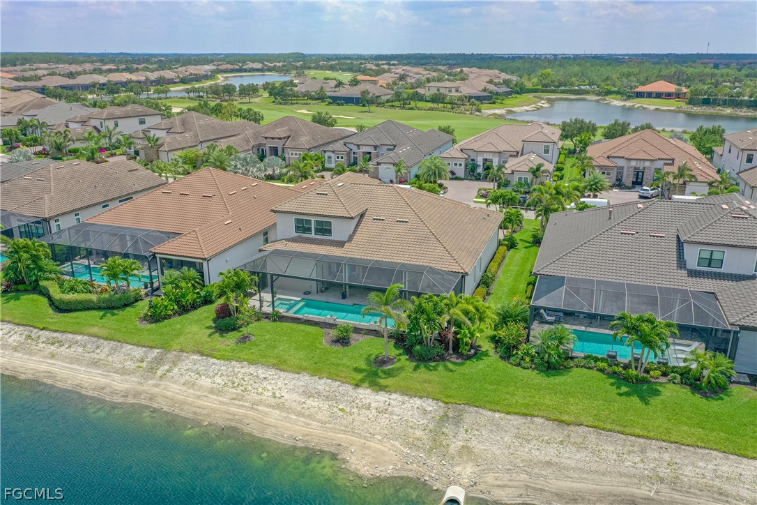 9345 Tulipano Terrace Naples, FL 34119 - Photo 45 of 50 an aerial view of residential houses with outdoor space and street view