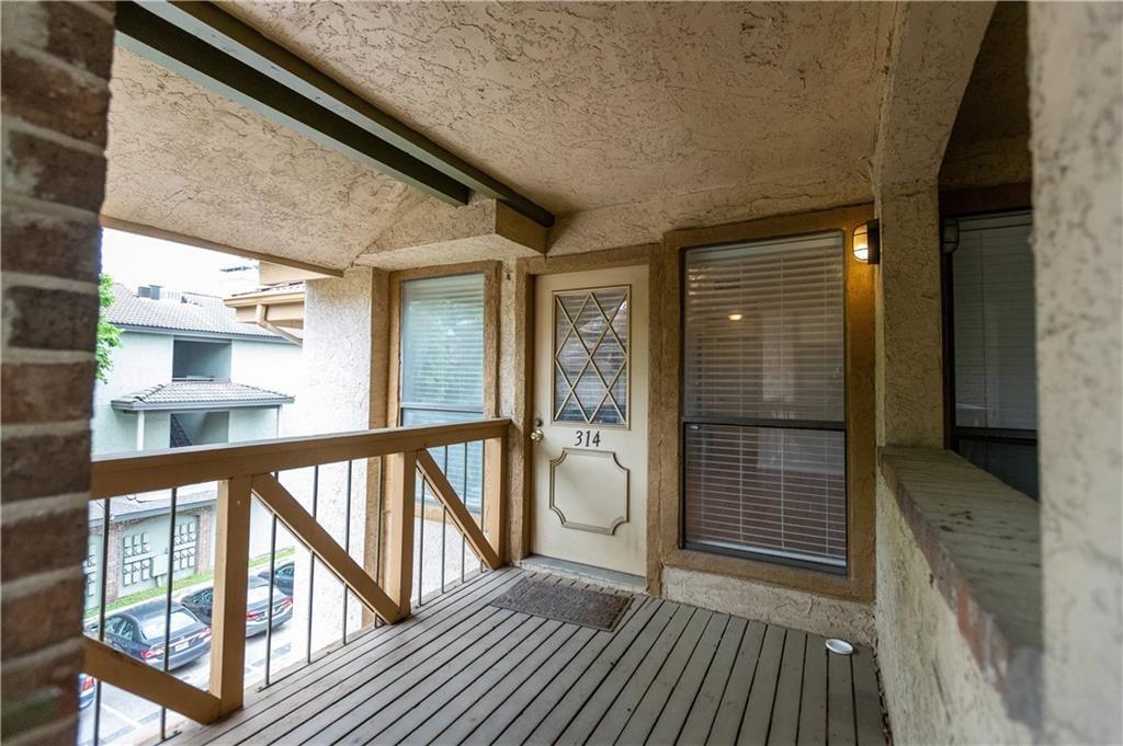 806 West 24th Street, Unit 314 Austin, TX 78705 - Photo 13 of 16 a view of balcony with wooden floor