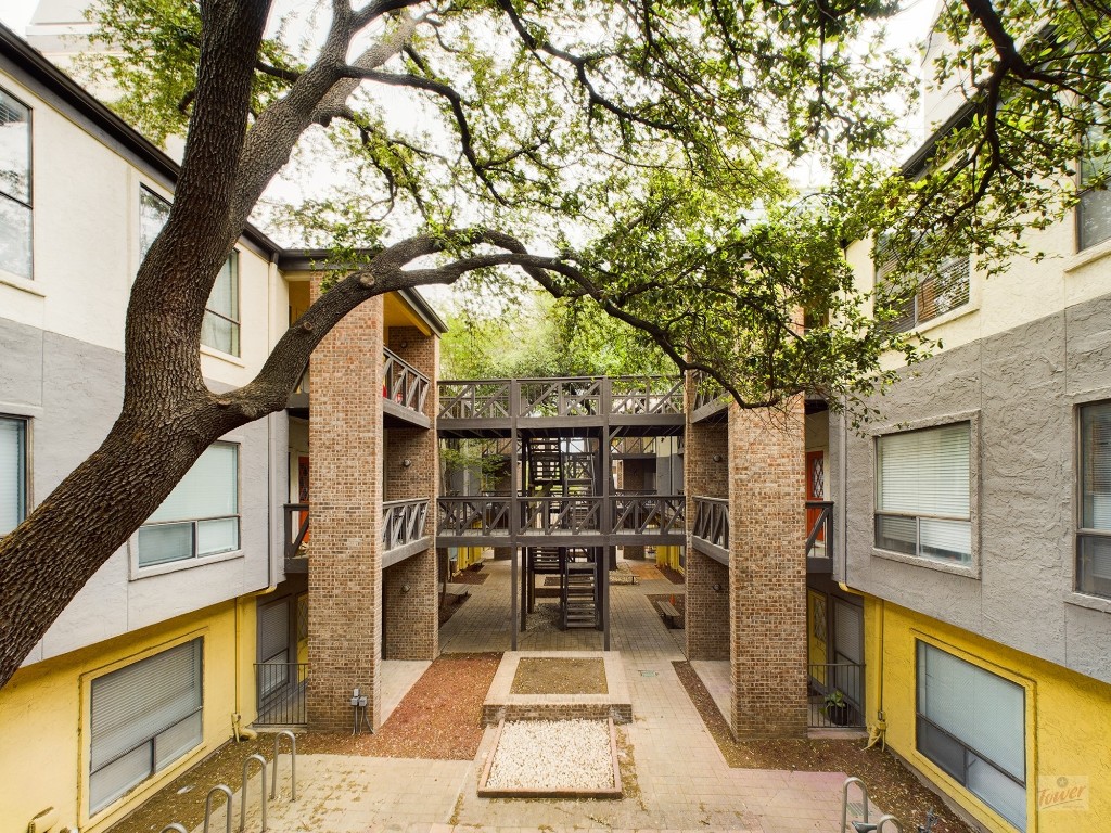 806 West 24th Street, Unit 314 Austin, TX 78705 - Photo 14 of 16 a view of a pathway of a house with a tree
