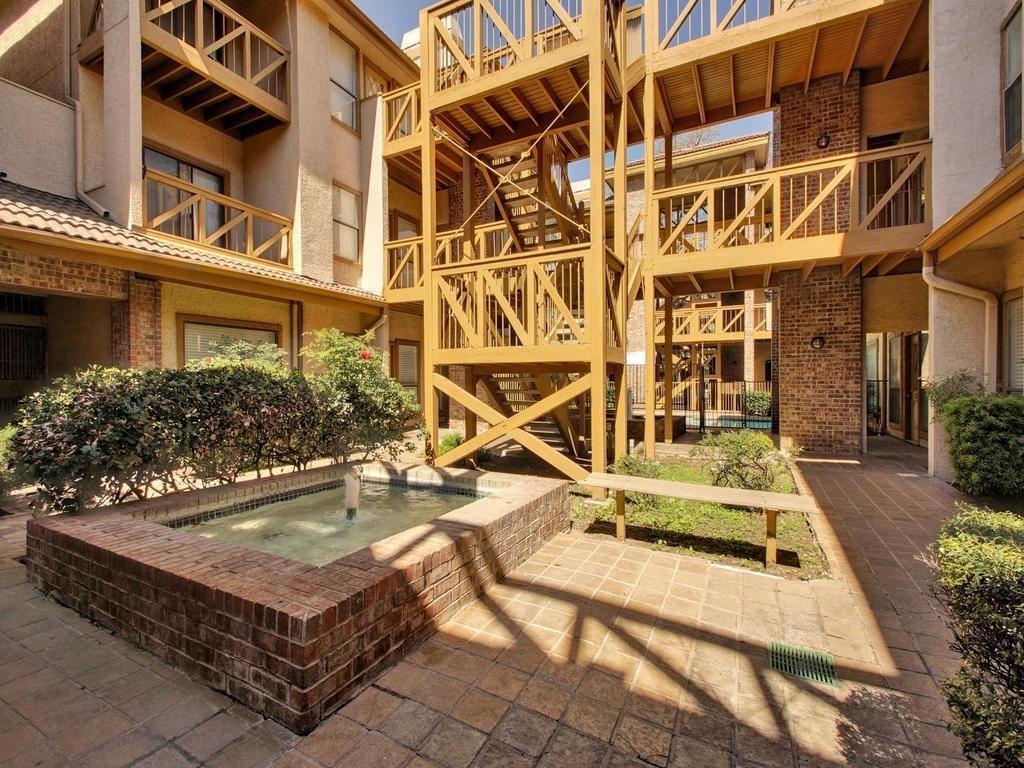 806 West 24th Street, Unit 314 Austin, TX 78705 - Photo 2 of 16 front view of a building with a bench