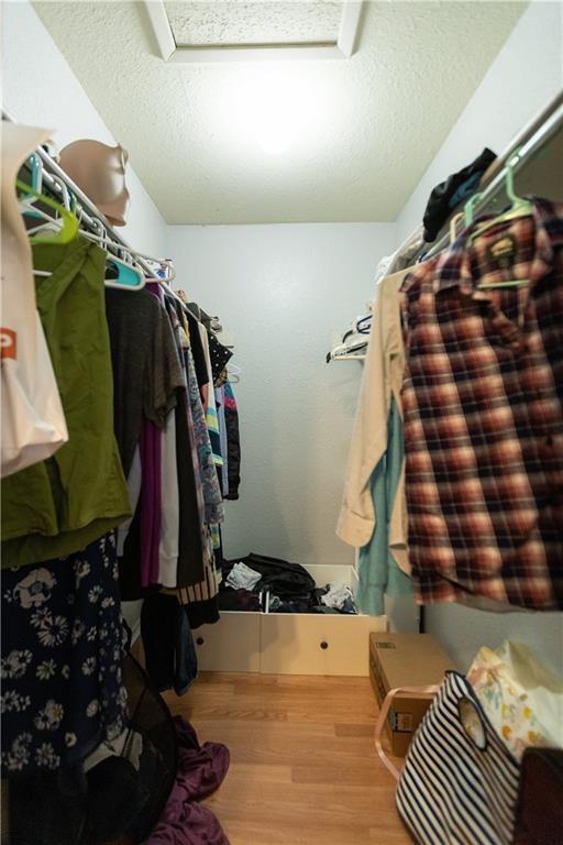 806 West 24th Street, Unit 314 Austin, TX 78705 - Photo 9 of 16 a view of walk in closet with clothes and shoes