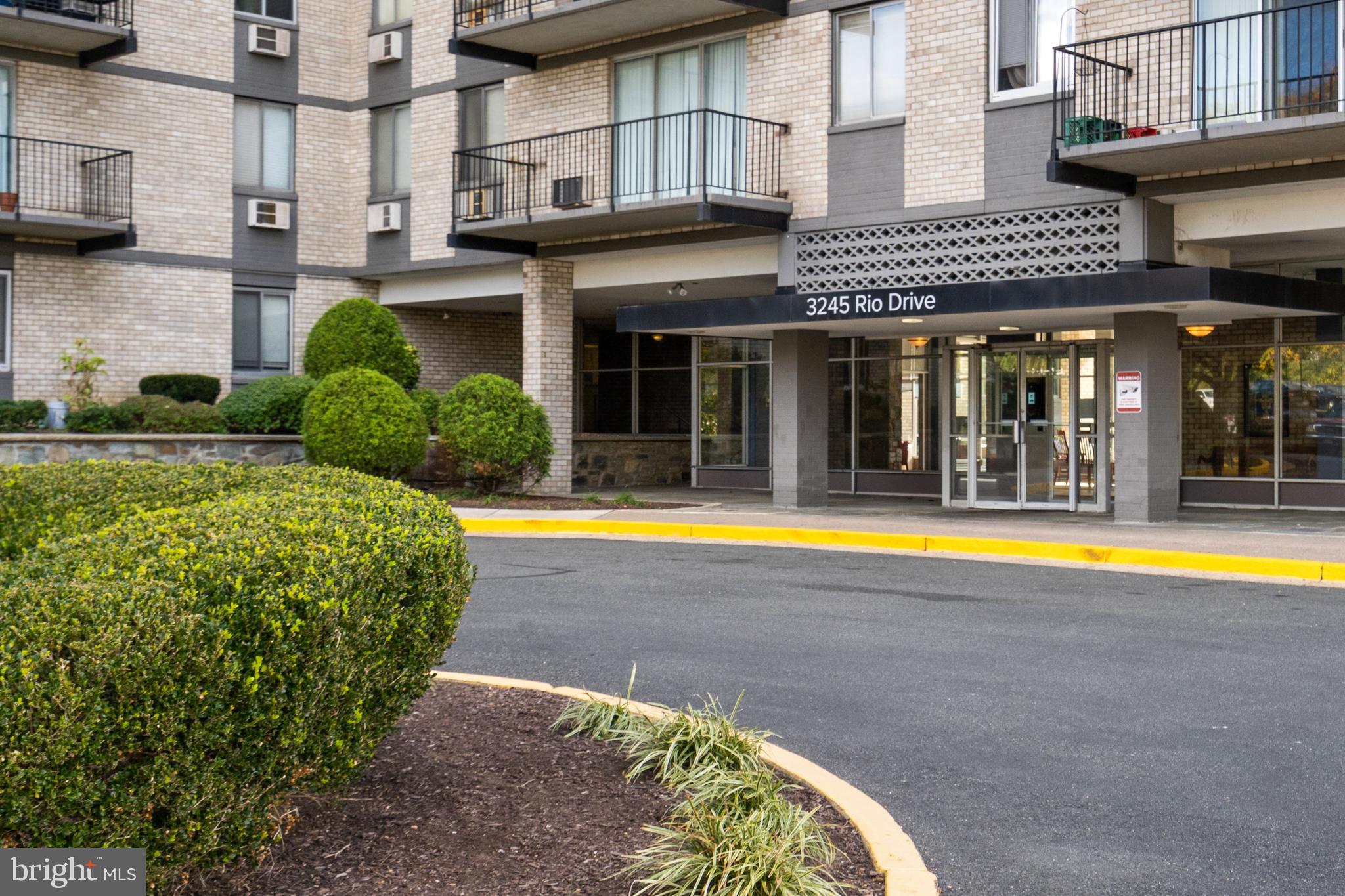 a view of a house with swimming pool and a porch