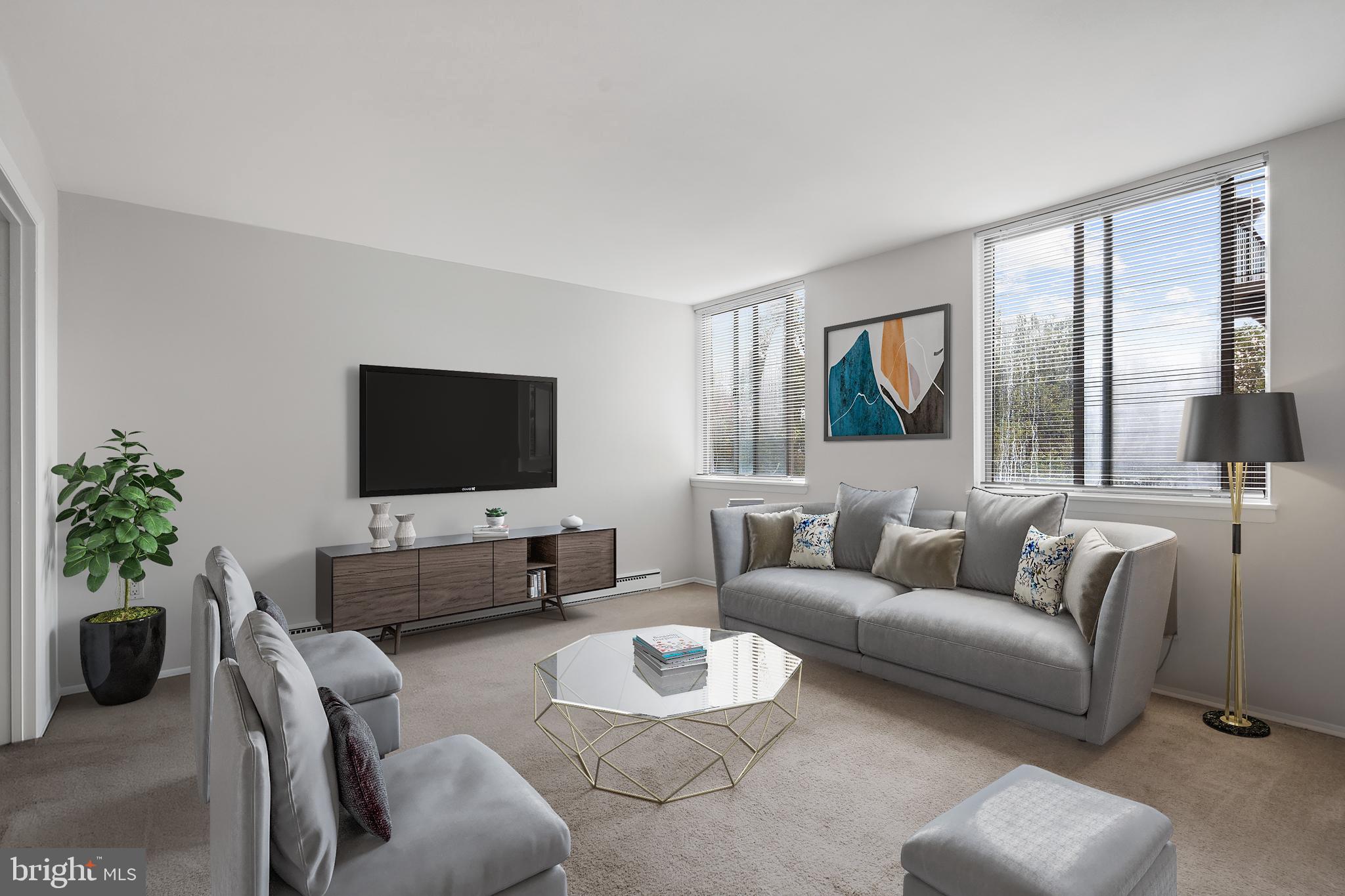3245 Rio Drive, Unit 714 Falls Church, VA 22041 - Photo 18 of 30 a living room with furniture and a flat screen tv