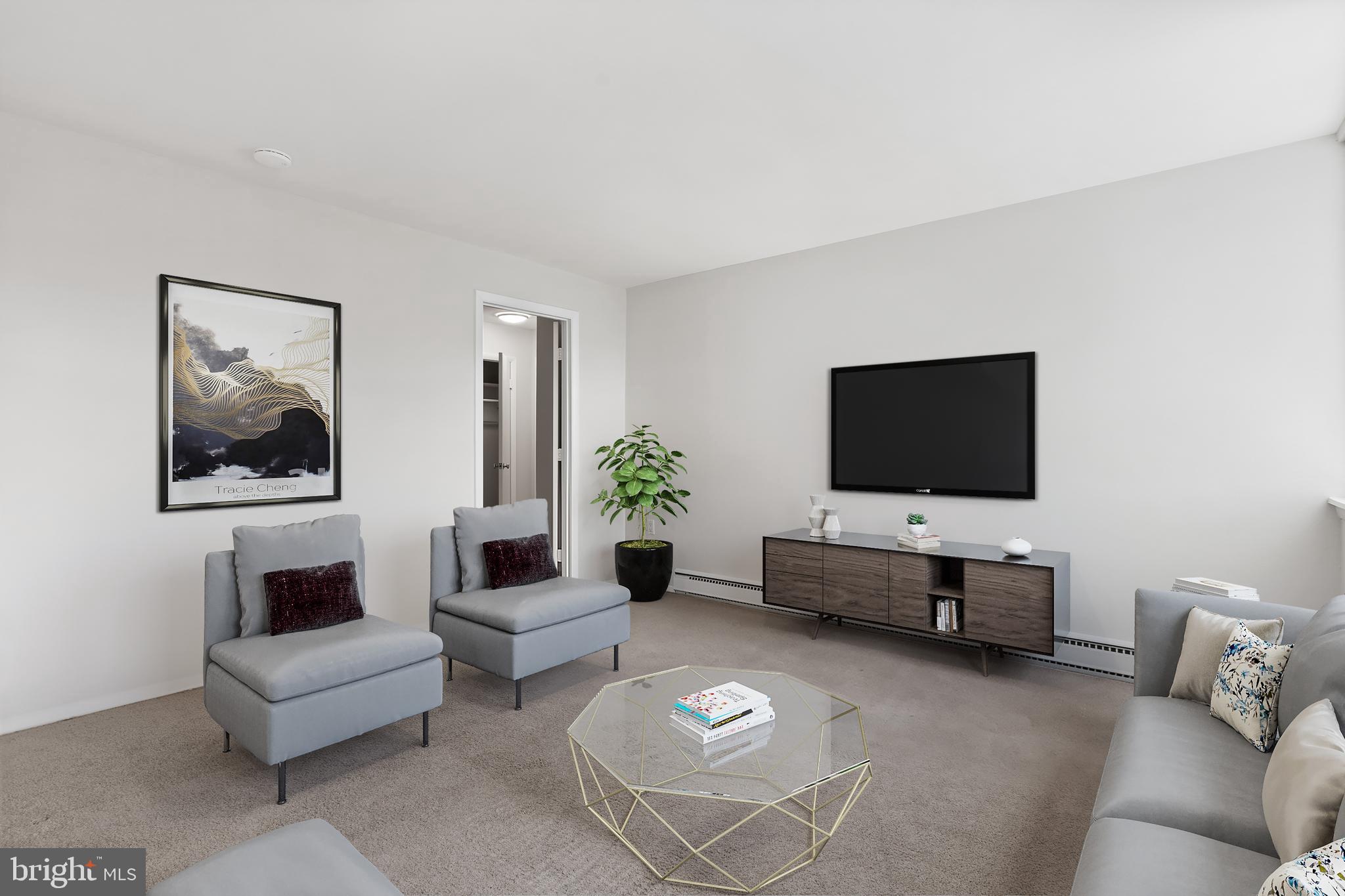 3245 Rio Drive, Unit 714 Falls Church, VA 22041 - Photo 20 of 30 a living room with furniture and a flat screen tv