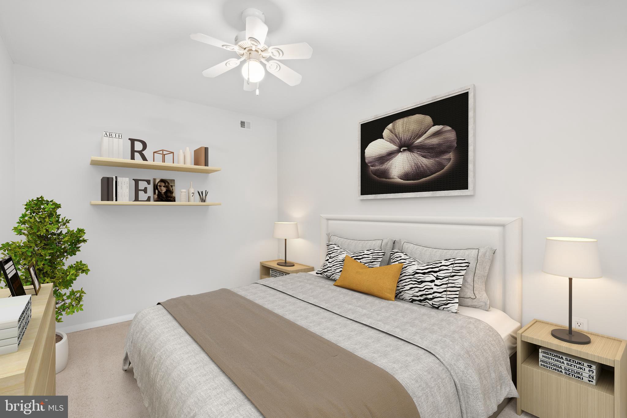 3245 Rio Drive, Unit 714 Falls Church, VA 22041 - Photo 27 of 30 a bedroom with a bed and a chandelier