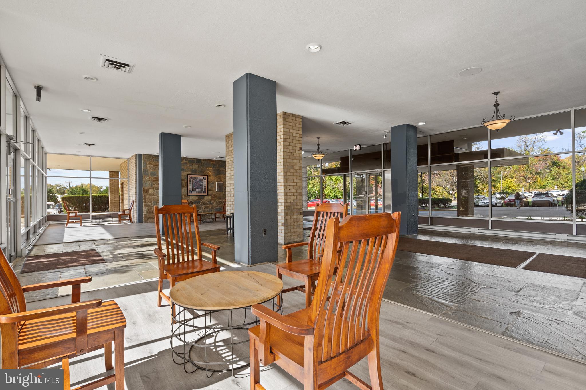 3245 Rio Drive, Unit 714 Falls Church, VA 22041 - Photo 3 of 30 a dining room with furniture and a floor to ceiling window