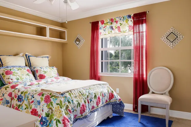 a bedroom with bed and a window