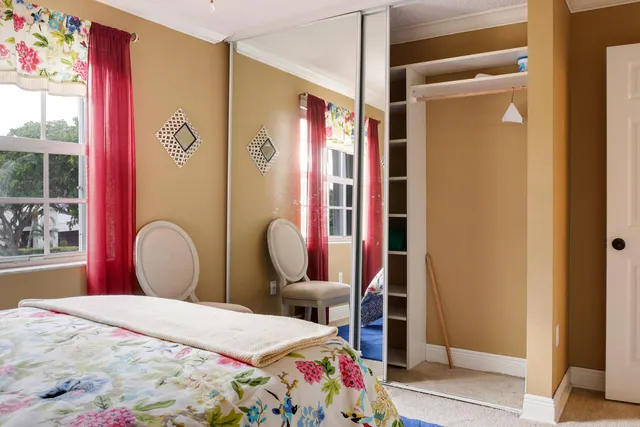 a bedroom with furniture and windows