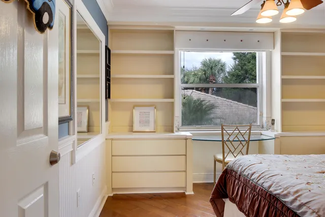 a view of a livingroom with furniture and a mirror