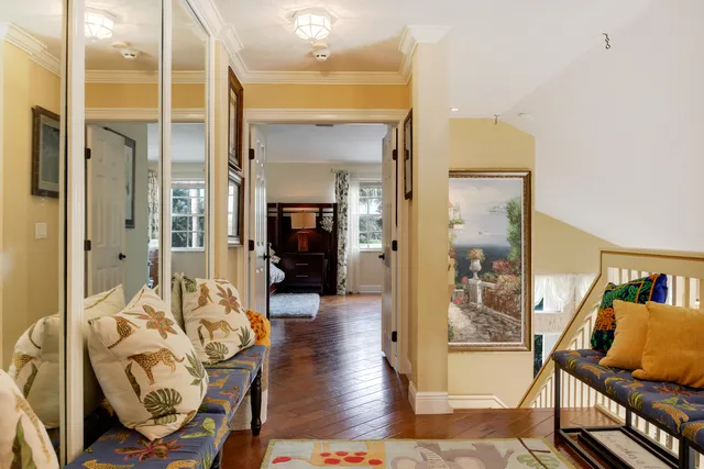 a dresser sitting in a bedroom next to a window