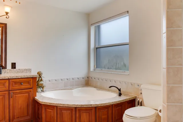 a bathroom with a glass shower door