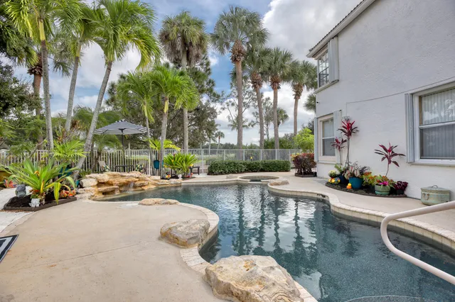 a view of a swimming pool with a patio