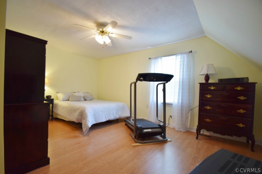 2301 Garrison Place Road Midlothian, VA 23112 - Photo 18 of 24 a bedroom with a bed and a chandelier