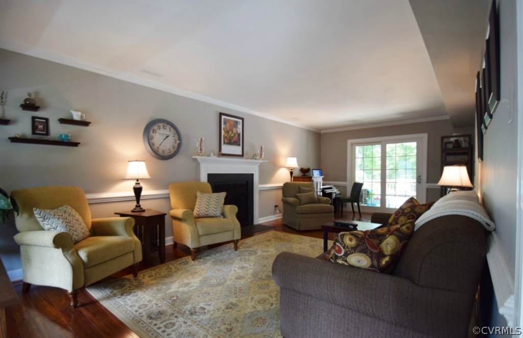 2301 Garrison Place Road Midlothian, VA 23112 - Photo 4 of 24 a living room with furniture a fireplace and a large window