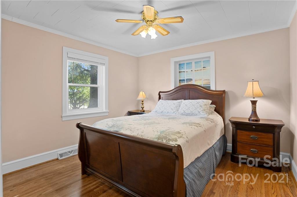 2125 Stack Road Monroe, NC 28112 - Photo 15 of 38 a bedroom with a bed and a chandelier
