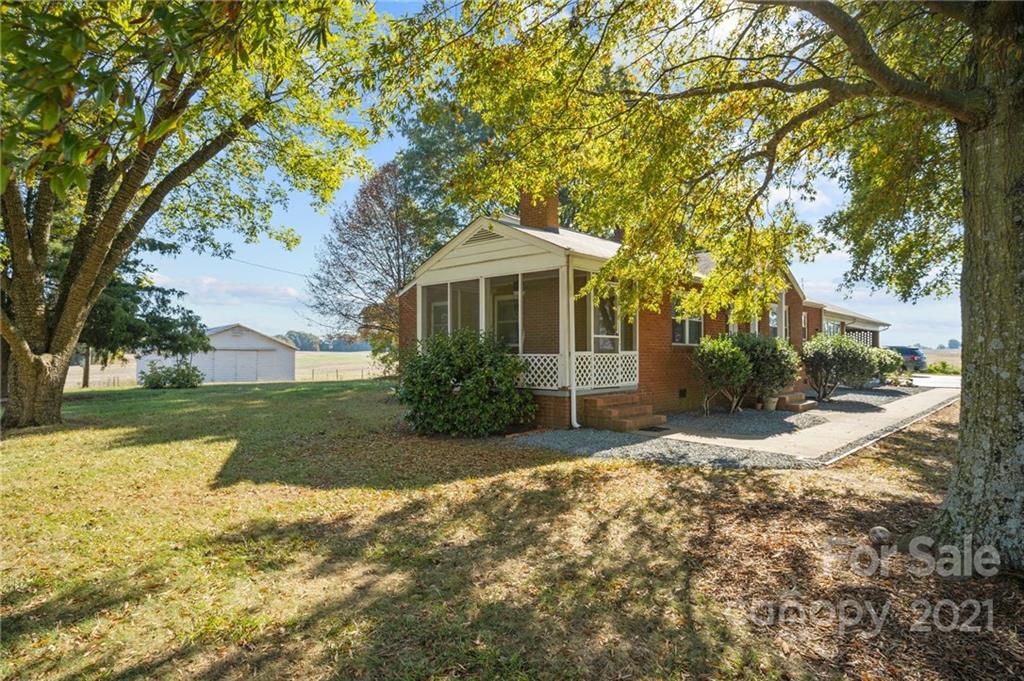 2125 Stack Road Monroe, NC 28112 - Photo 20 of 38 a front view of a house with a yard and trees