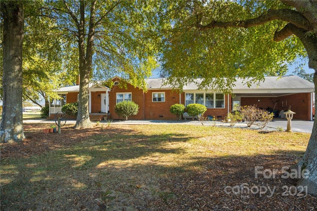2125 Stack Road Monroe, NC 28112 - Photo 22 of 38 a front view of a house with swimming pool having outdoor seating