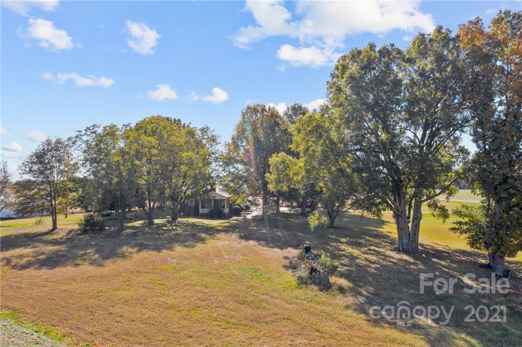 2125 Stack Road Monroe, NC 28112 - Photo 25 of 38 a view of a yard with yellow lighting