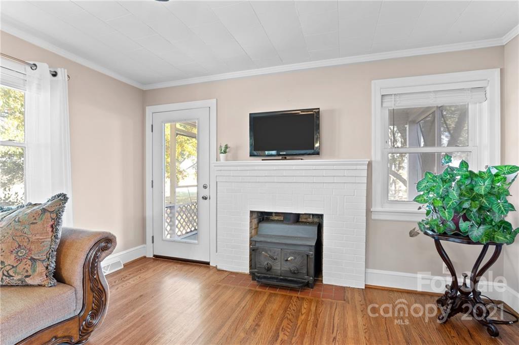 2125 Stack Road Monroe, NC 28112 - Photo 5 of 38 a living room with furniture a flat screen tv and a fireplace