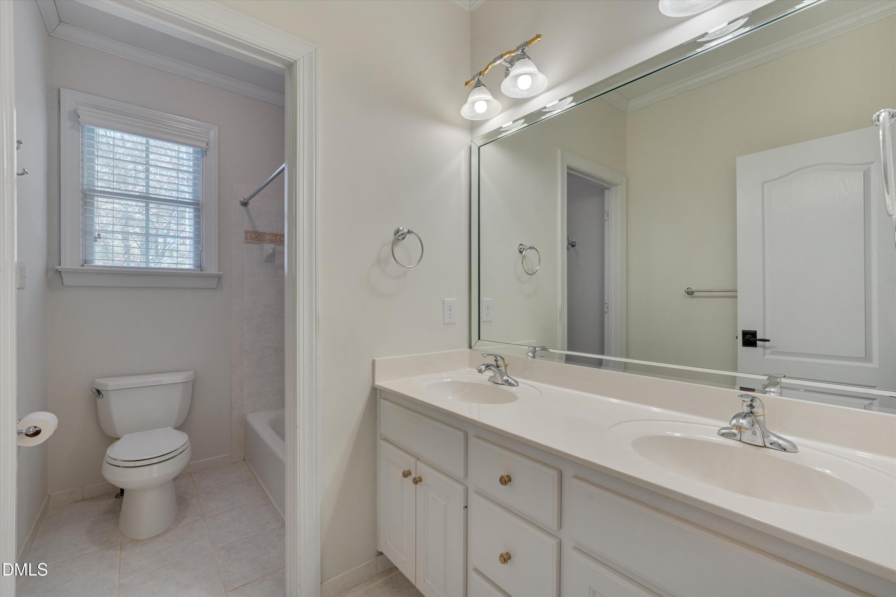 7013 Potomac Court Raleigh, NC 27613 - Photo 53 of 78 Shared bathroom in second floor with dual vanities