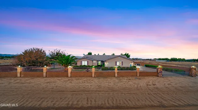 a view of house with outdoor space and sitting area
