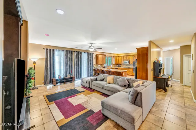 a large kitchen with stainless steel appliances lots of counter space and breakfast area